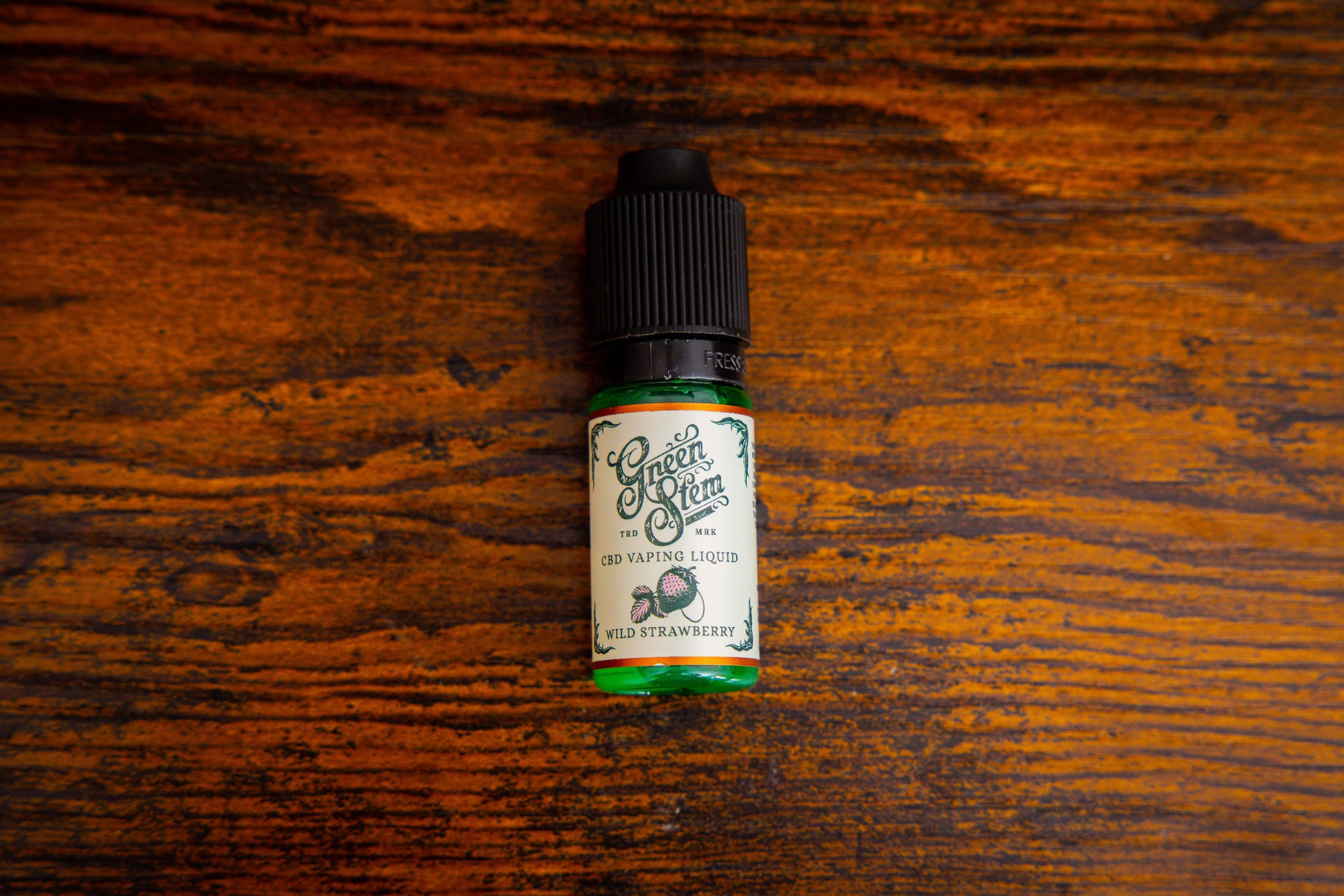 Wild Strawberry CBD Vape juice bottle by Green Stem 